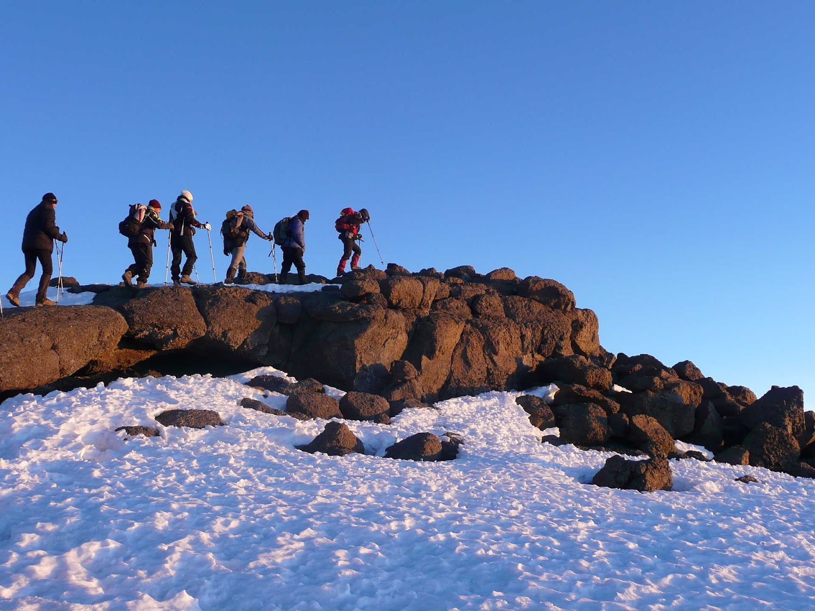 Trekking on a snowy mountain path